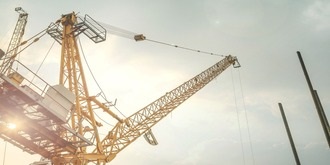 Construction crane and equipment on a building site outside