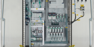 Open control panel with components showing inside and on the door