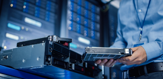 ALT Text: Data Center operator working on installing a new Fiber cassette