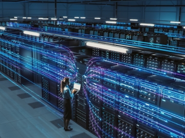 Data Center operators examine the power of a data center cabinet