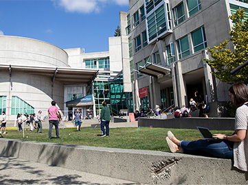 Students outdoors in a common area at capilano university