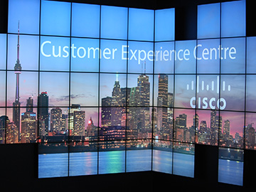 Lighted sign showing a skyline of Toronto and a cisco logo