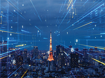 Brightly lit tower against a dark background with buildings around it and symbols indicating network data