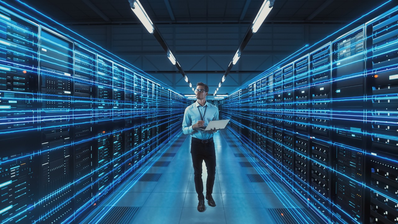 A Data Center manager walks an AI data center with fiber cabling