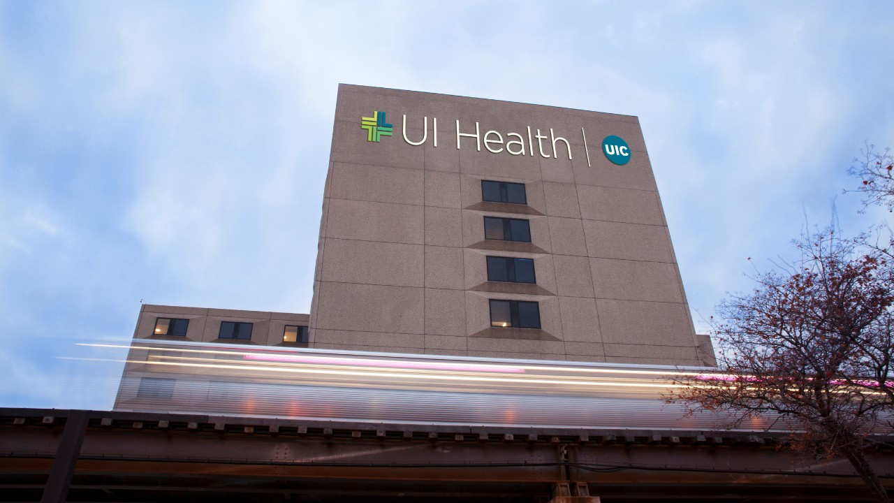 UI Health hospital shown outside with clouds in t he background